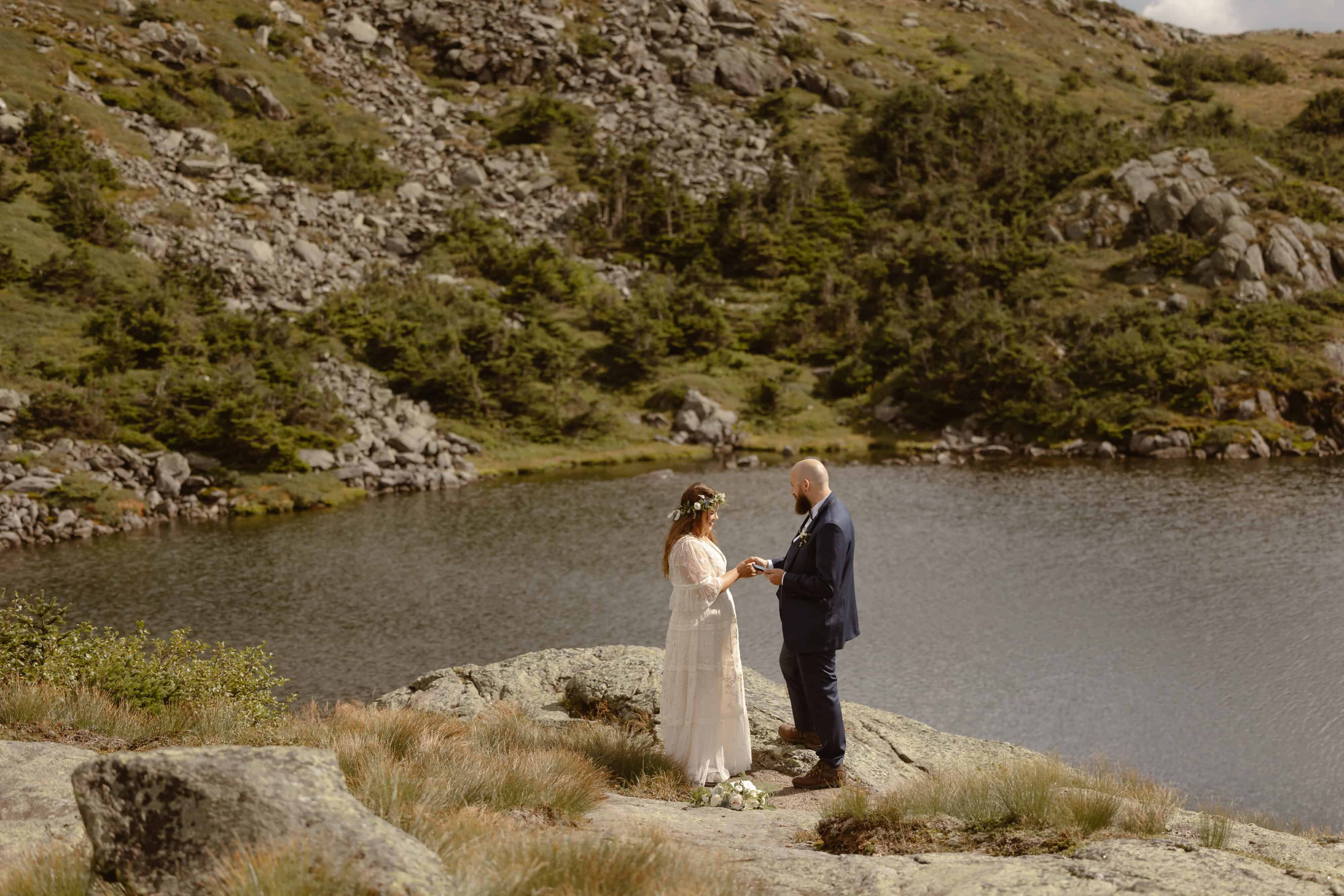 a couple getting saying their vows on mount washington 