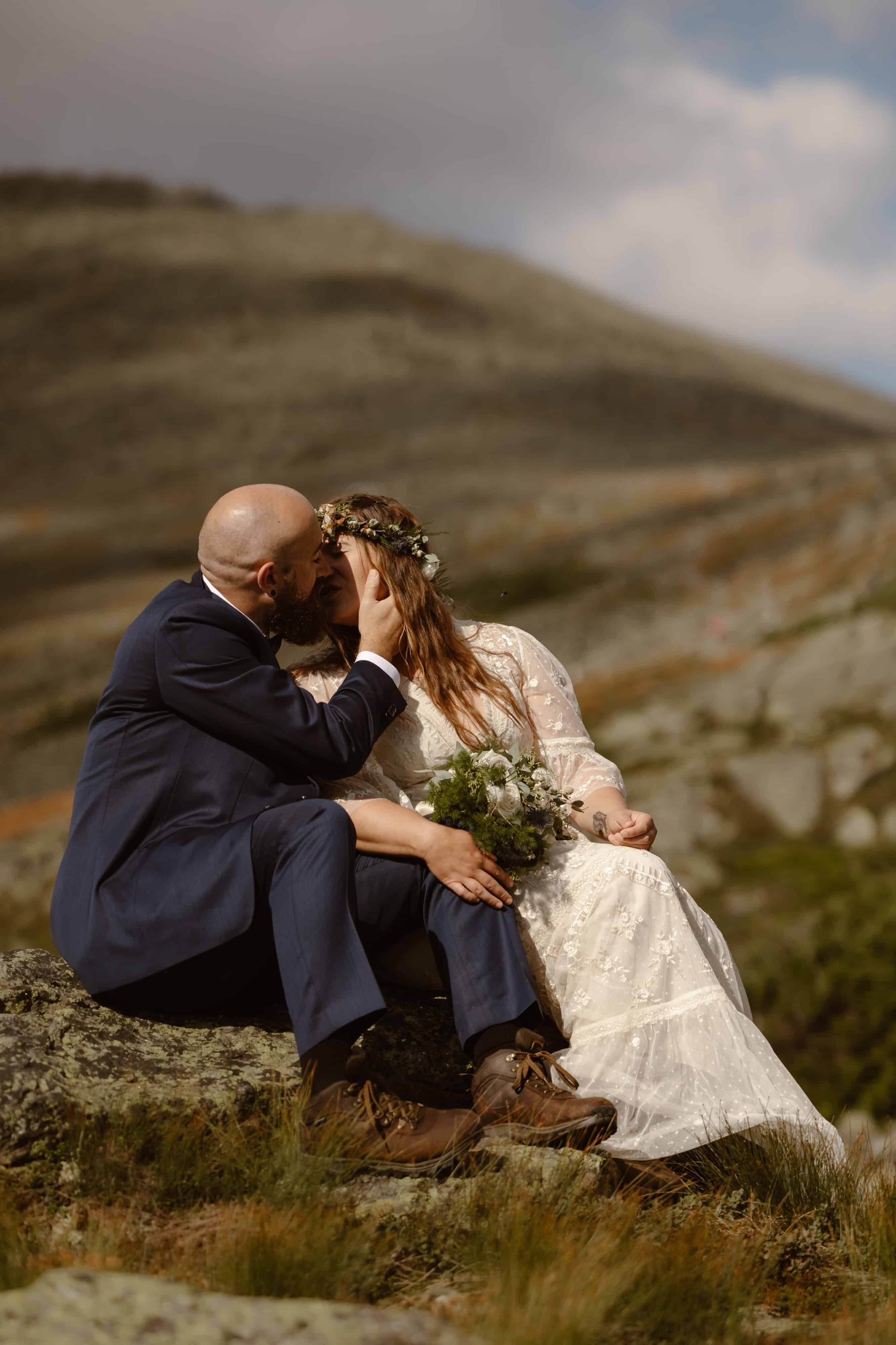 A bride and groom kissing during their Mount Washington elopement