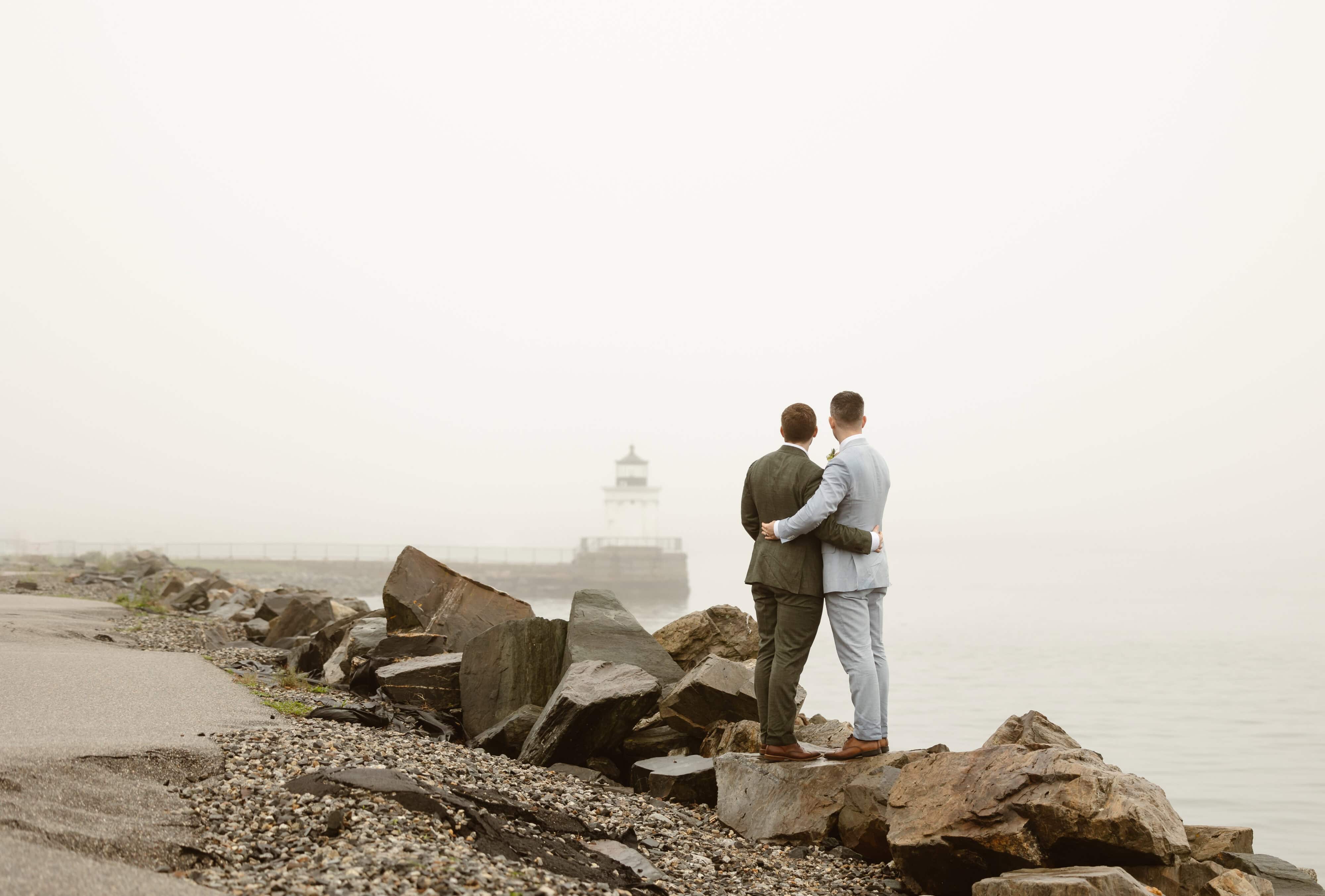 A couple elopes on a foggy day at Bug Light Park in Portland, Maine