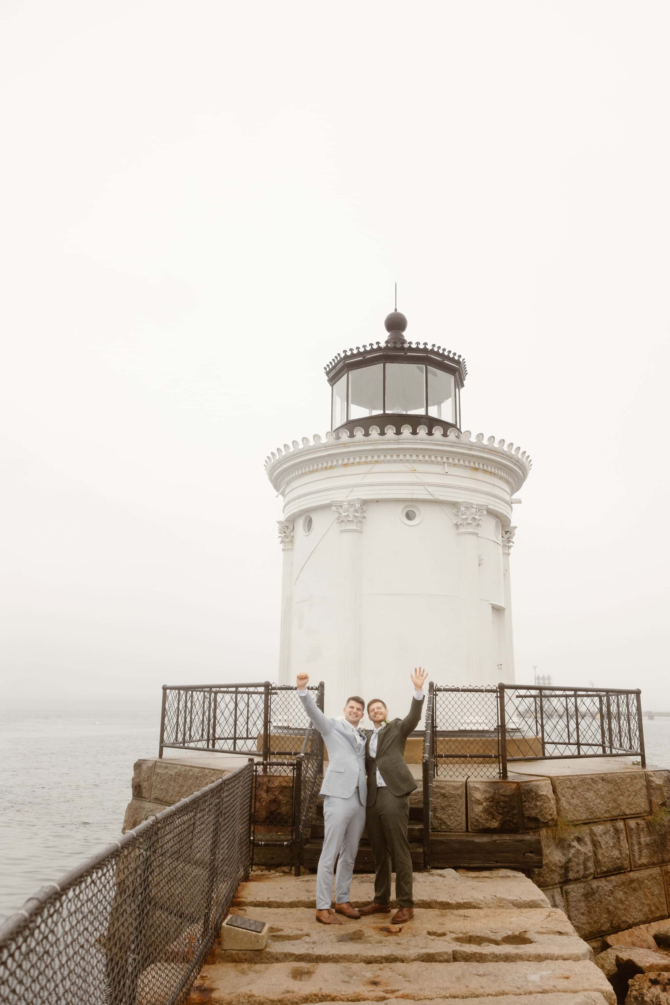 A couple celebrates their marriage at Bug Light Park in Portland, Maine.